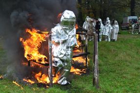 Rescuers pass through the burning labyrinth