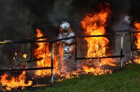 Rescuers pass through the burning labyrinth