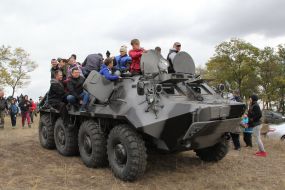 Children on armored personnel carriers