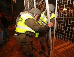 Soldiers of the National Guard fix the fence near parliament of Ukraine