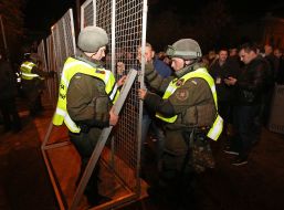 Soldiers of the National Guard fix the fence near parliament of Ukraine