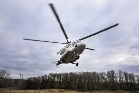 Helicopter over the territory of the military training ground