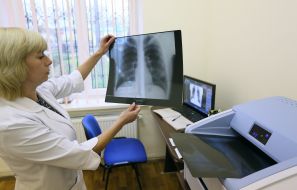 The doctor holds an X-ray