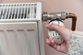 The woman regulates the heat in the battery
