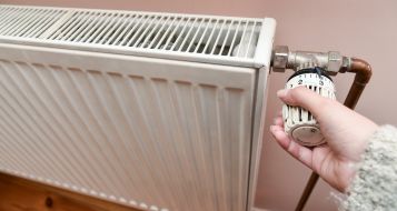 The woman regulates the heat in the battery