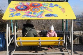 Swings with Petrikov painting