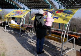 Swings with Petrikov painting