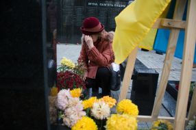 Woman near the grave of the deceased ATO participant