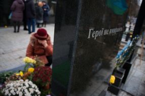 Woman near the grave of the deceased ATO participant