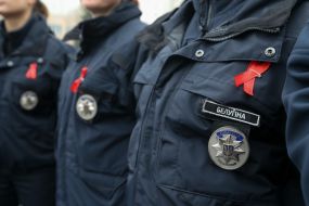 Policemen with a red ribbon on a uniform