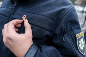 Red Ribbon icon on police uniform