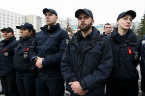 Policemen with a red ribbon on a uniform