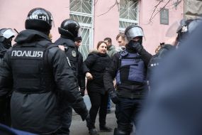 Olga Halabala and law enforcement officers