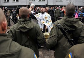 The priest conducts the consecration ceremony