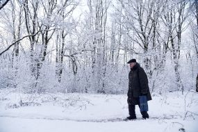 The man crosses the road