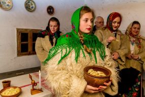 The girl holds the pitcher