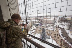 A soldier takes pictures of Sofia Square