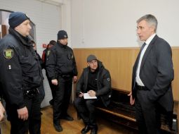 Vladislav Grischenko communicates with police officers