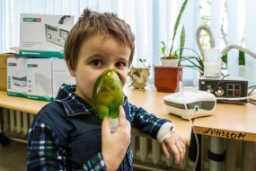 The boy is testing a modern inhaler