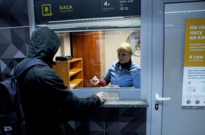 The passenger buys a tram ticket