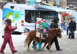 Children are riding a pony
