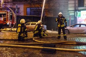 Rescuers extinguish the fire