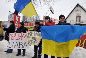 Activists lined up in a symbolic chain