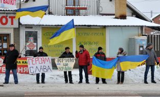 Activists lined up in a symbolic chain