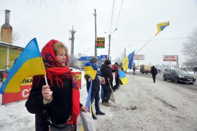 Activists lined up in a symbolic chain