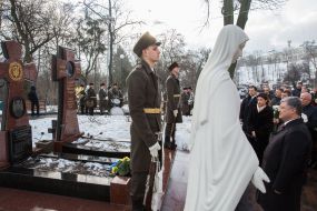Laying flowers at the Cross Cross Heroes Krut