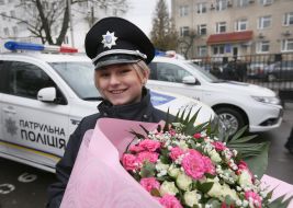 A patrol police officer with flowers