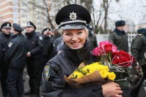 A patrol police officer with flowers