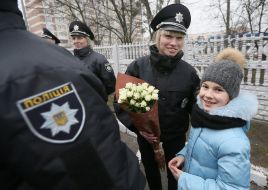 A patrol police officer with flowers