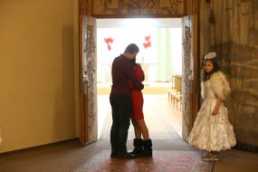 A couple of Natalia and Igor with a girl in the costume of an angel