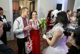 The newlyweds drink champagne
