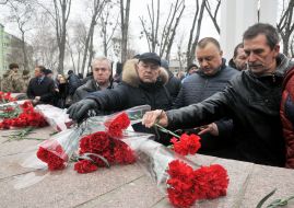 Laying flowers to a monument to dead soldiers in Afghanistan