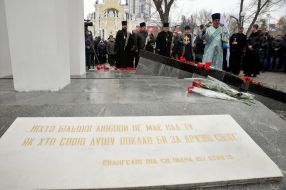 Laying flowers to a monument to dead soldiers in Afghanistan