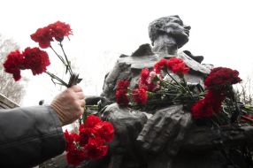 Laying flowers to a monument to dead soldiers in Afghanistan