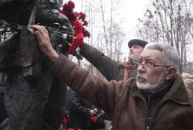 Laying flowers to a monument to dead soldiers in Afghanistan