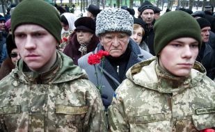Laying flowers to a monument to dead soldiers in Afghanistan