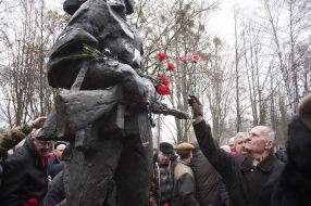 Laying flowers to a monument to dead soldiers in Afghanistan