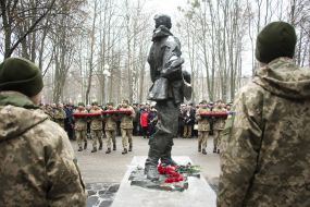 Laying flowers to a monument to dead soldiers in Afghanistan