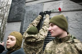 Laying flowers to a monument to dead soldiers in Afghanistan