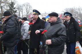 Laying flowers to the monument to the soldiers-internationalists