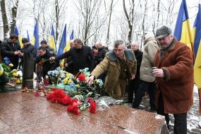Laying flowers to the monument to soldiers who died in Afghanistan
