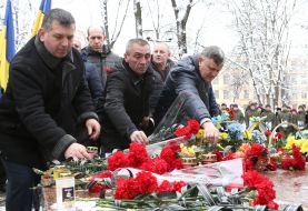 Laying flowers to the monument to soldiers who died in Afghanistan