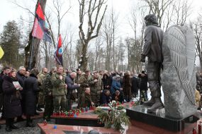 Laying flowers at the grave of Roman Gurik