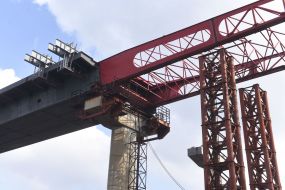 The final stage of sliding the bridge's metal structure across the Dnepr
