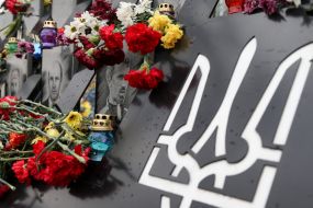 Laying flowers on the Heroes of Heaven's Hundred Alley