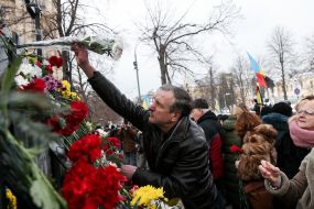 Laying flowers on the Heroes of Heaven's Hundred Alley